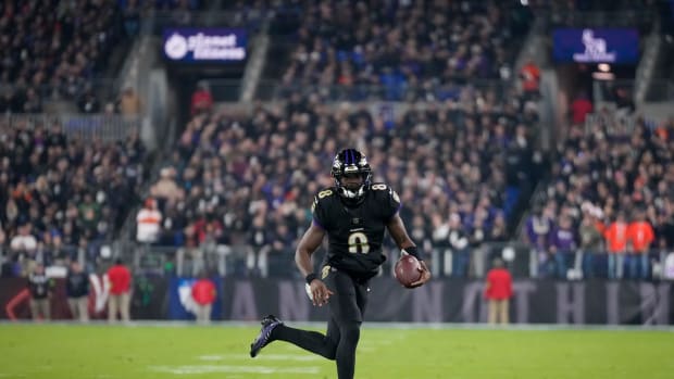 Baltimore Ravens quarterback Lamar Jackson (8) breaks away on a QB keeper in the first quarter of the NFL Week 11 game between the Baltimore Ravens and the Cincinnati Bengals at M&T Bank Stadium in Baltimore on Thursday, Nov. 16, 2023.